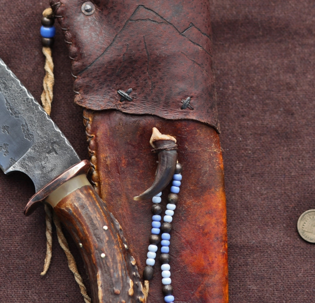 Wolf camp knife, carved antler