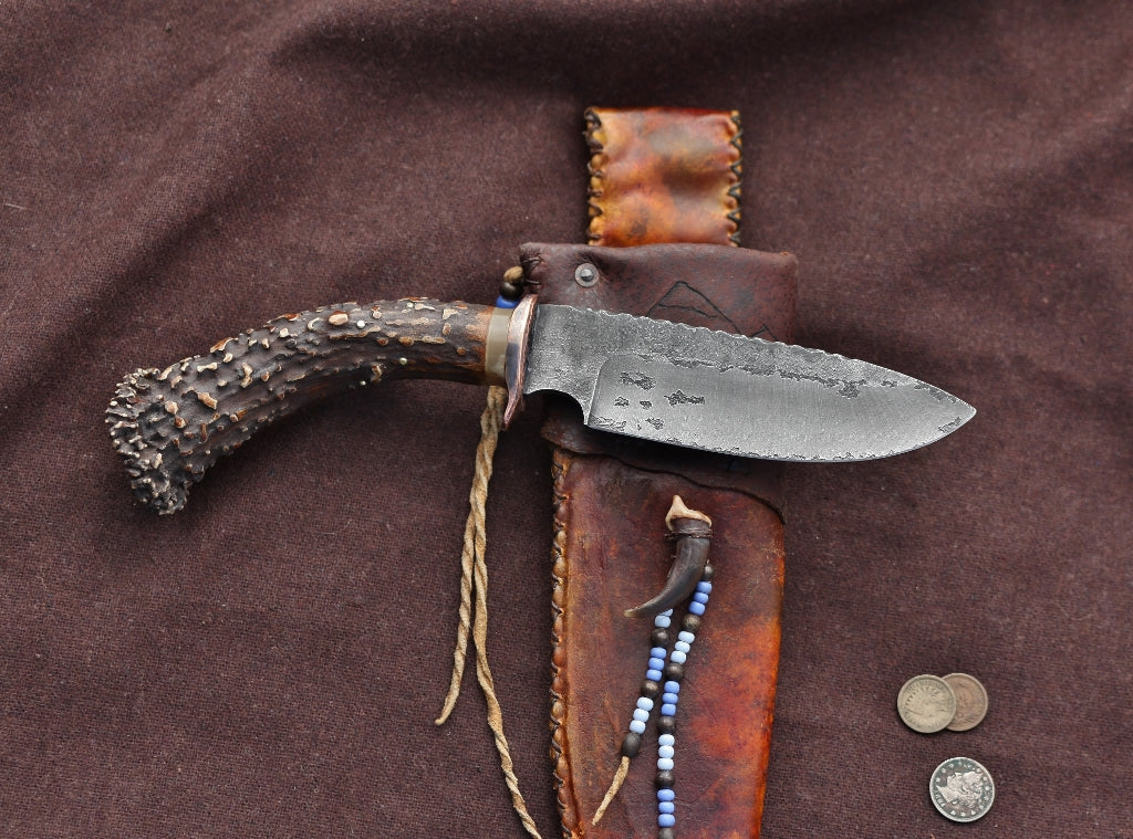Wolf camp knife, carved antler