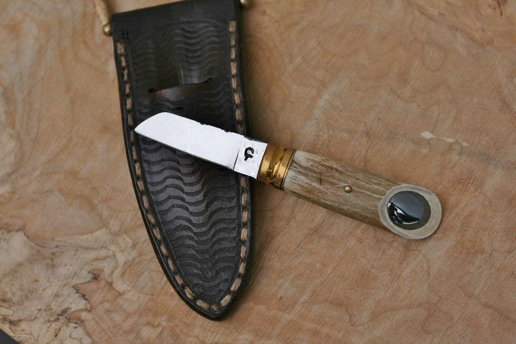 Custom neck knife, white tail antler and stone