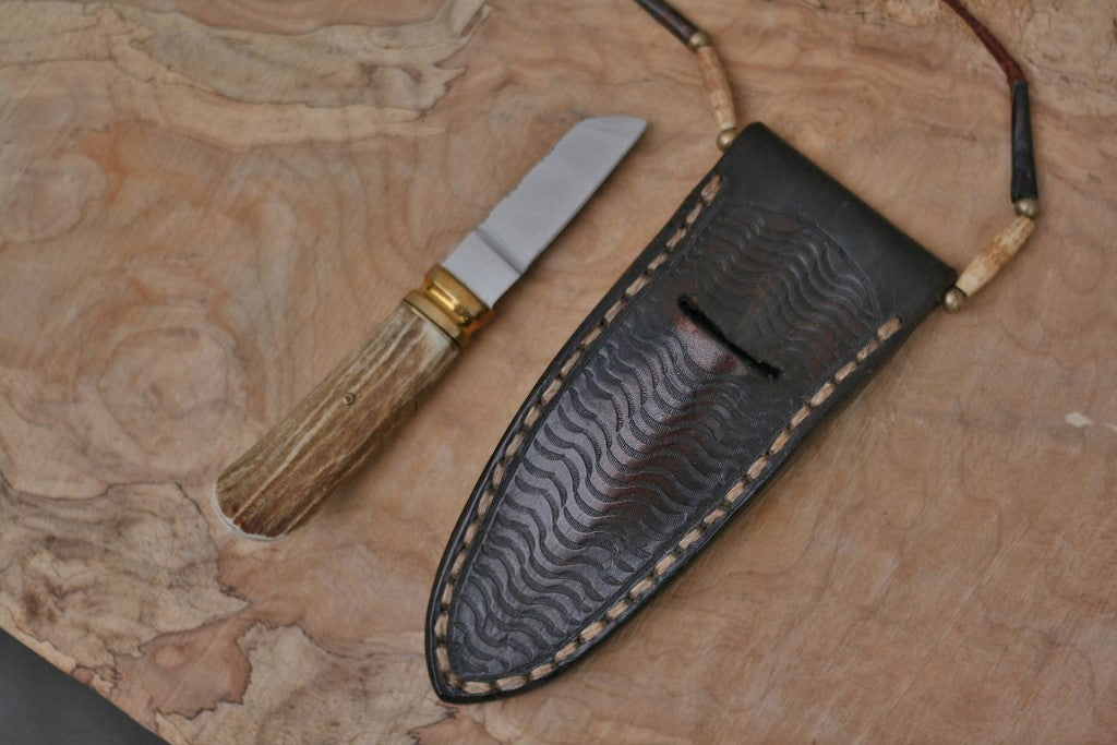 Custom neck knife, white tail antler and stone