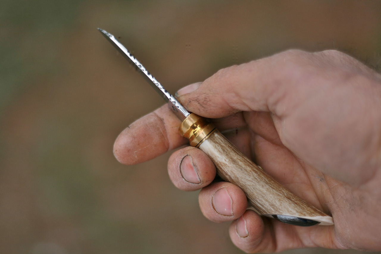 Custom neck knife, white tail antler and stone