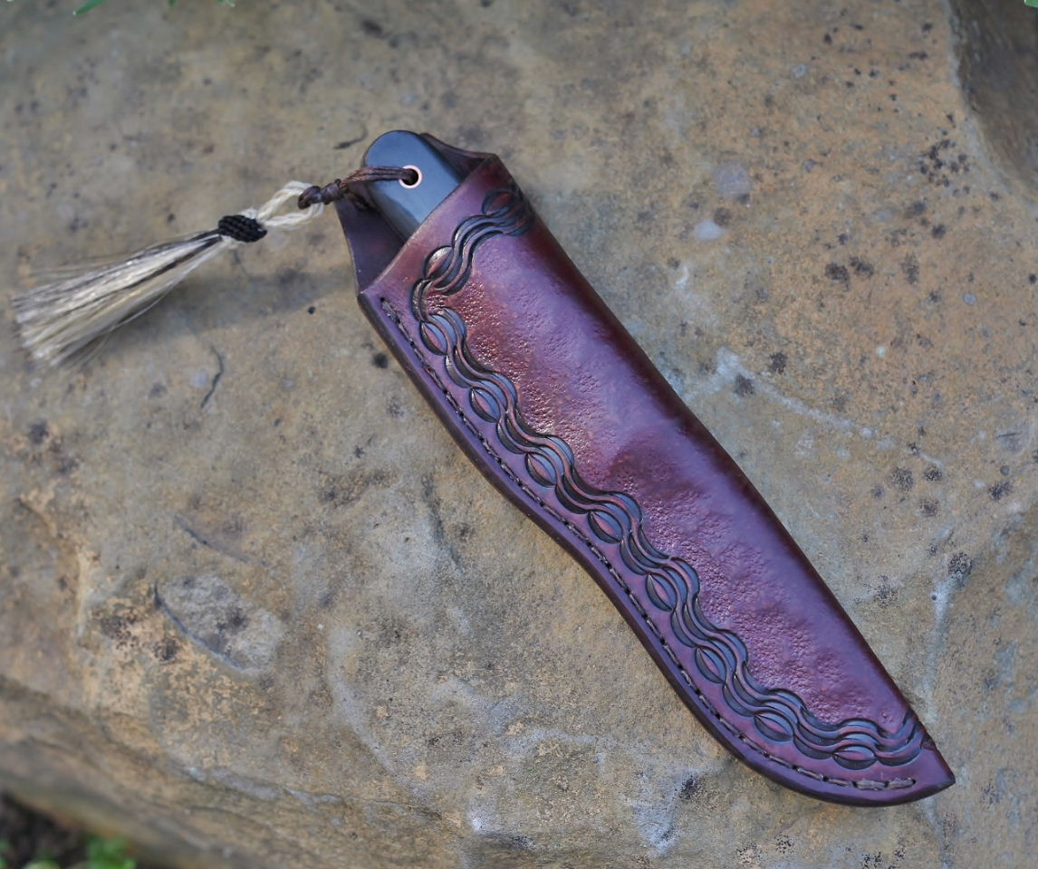 Etched hunter, water buffalo horn