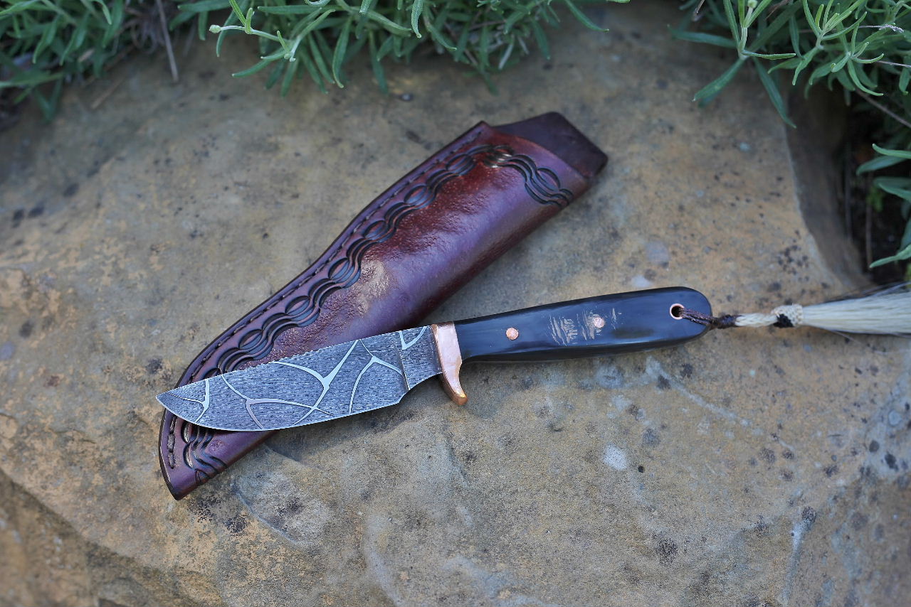 Etched hunter, water buffalo horn
