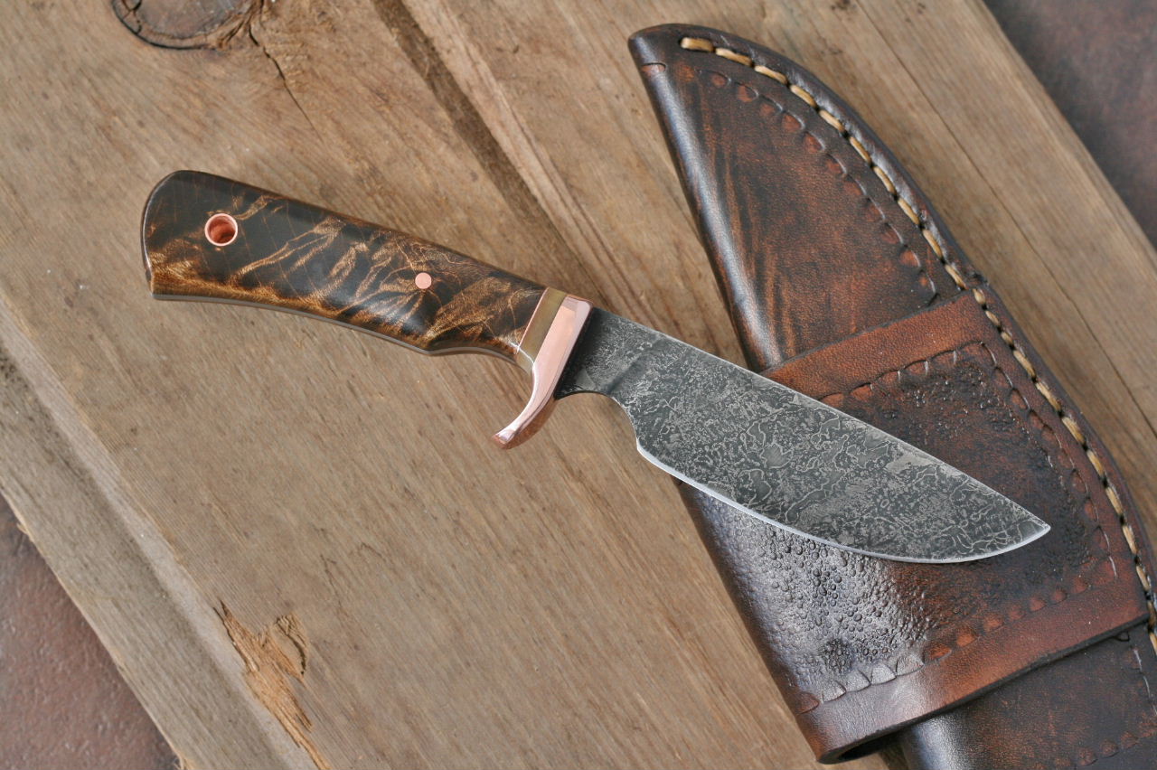 Custom drop point utility/skinner