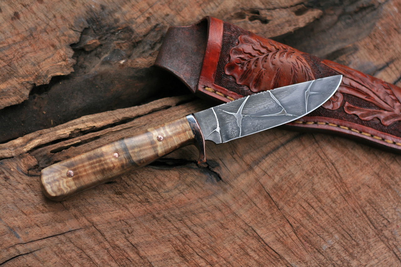 Etched hunter with spalted fiddleback maple.