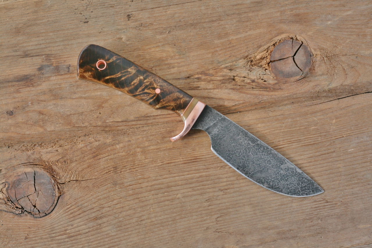 Custom drop point utility/skinner