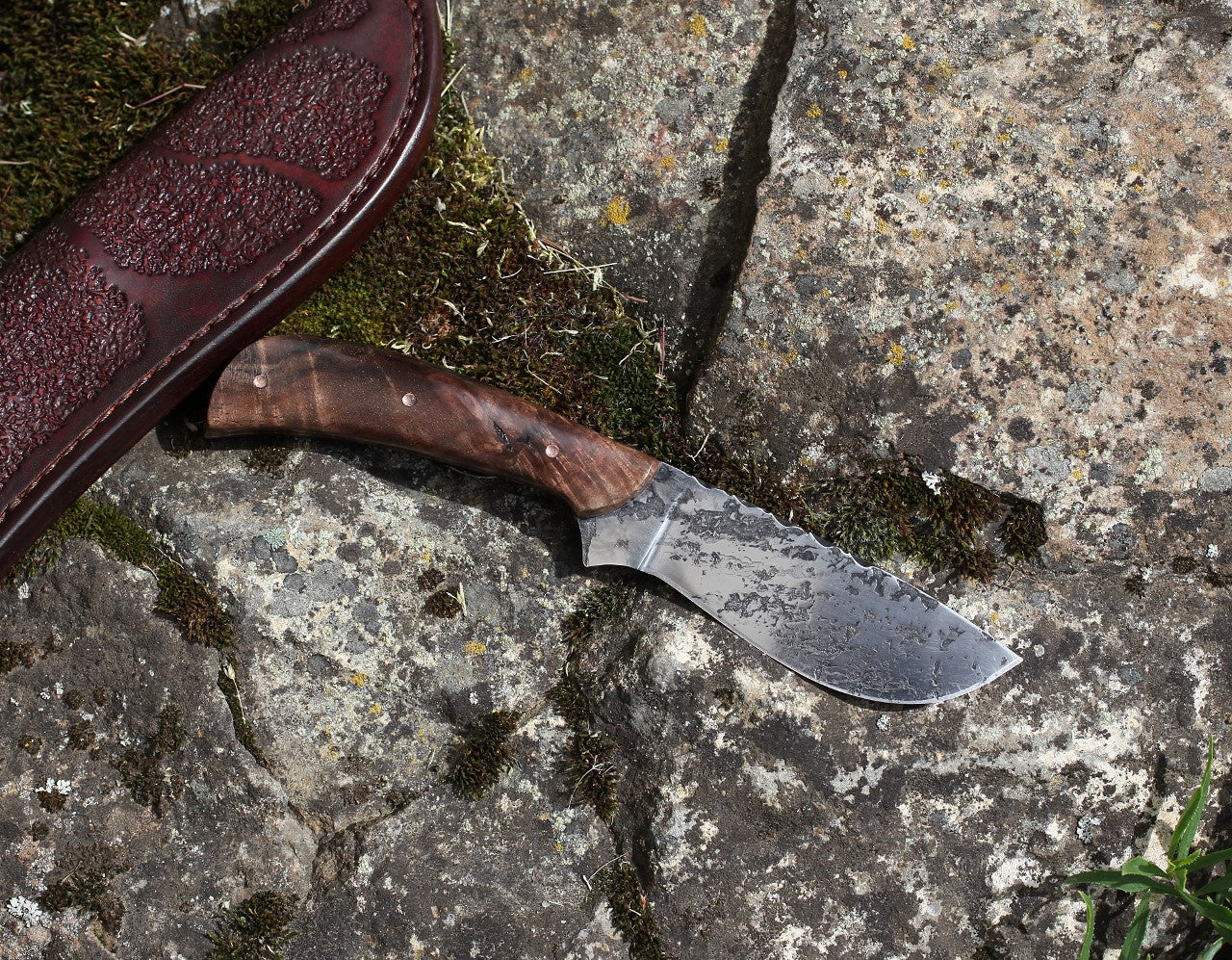 Large game hunter, redwood burl