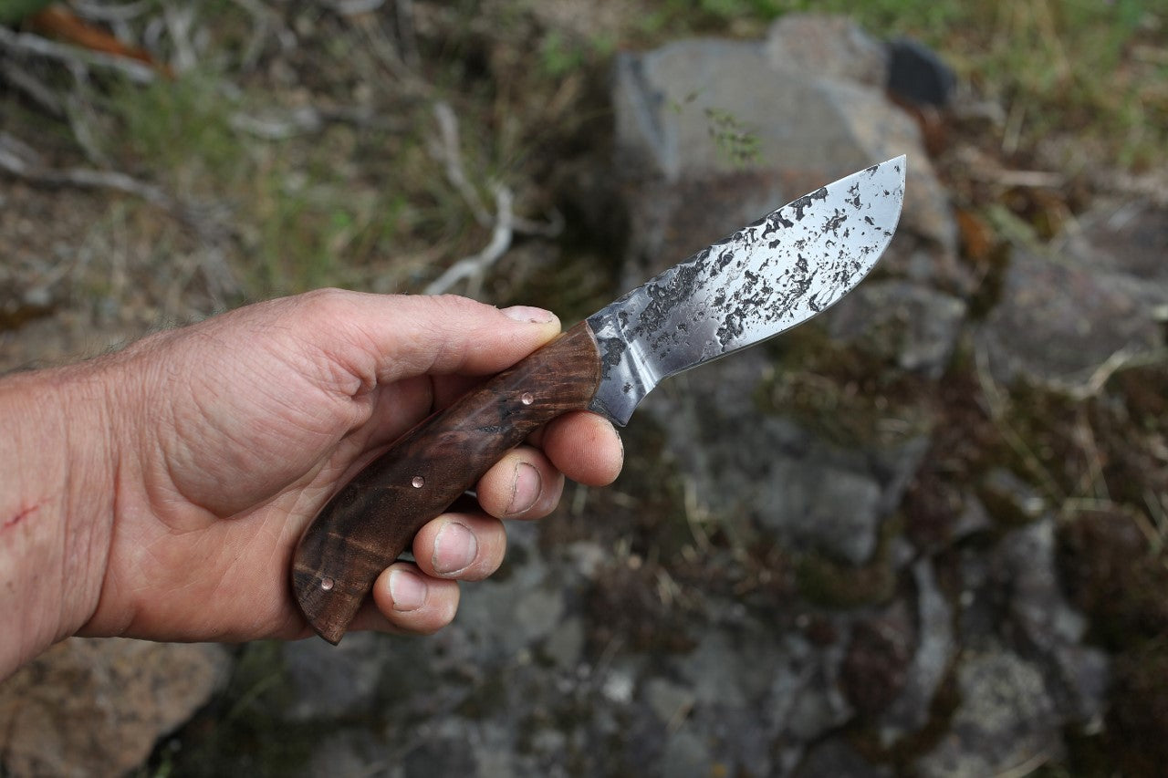 Large game hunter, redwood burl